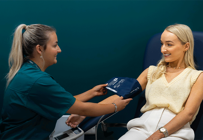 Randox Health blood pressure check with patient 