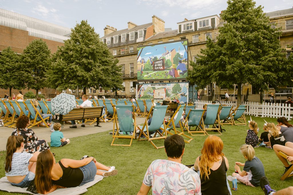 Visitors enjoying NE1 Screen on the Green in Old Eldon Square during Newcastle's free outdoor cinema programme.