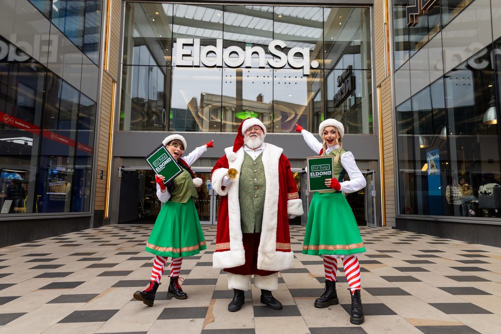 Santa Claus and two Christmas elves outside the Eldon Square entrance in Newcastle ahead of the 2026 festive celebrations.