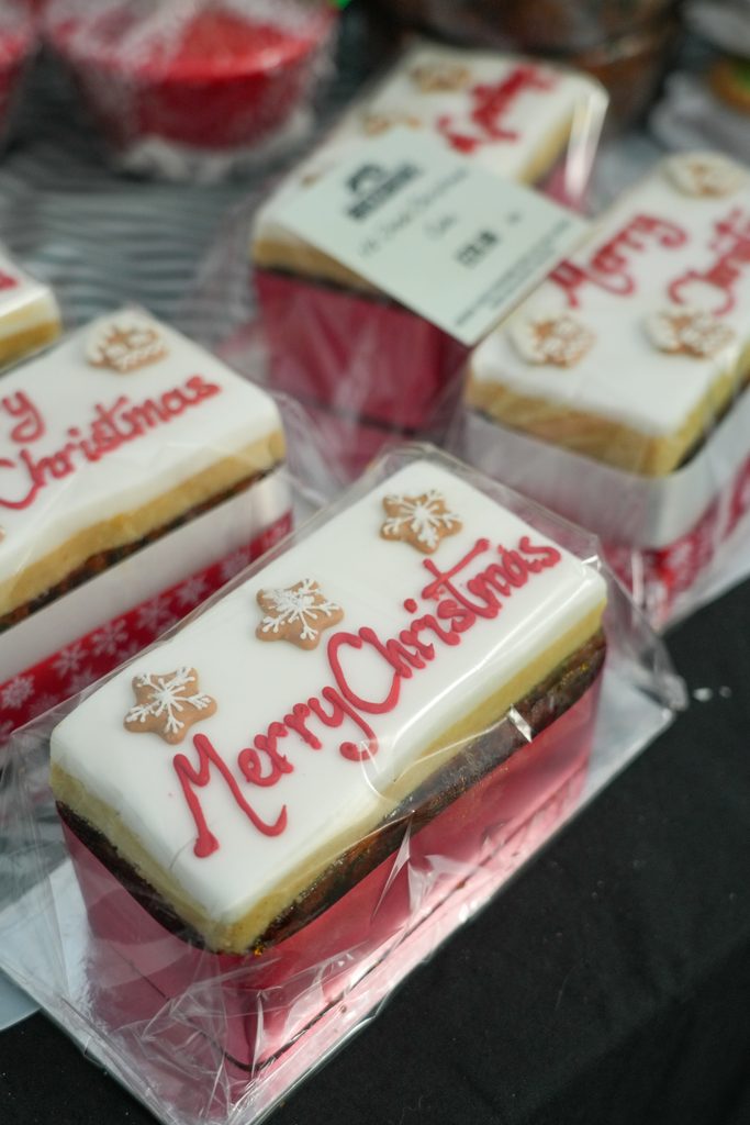 Festive market stalls displaying Christmas decorations, wreaths, ornaments and seasonal gifts at Brocksbushes Christmas Fayre.
