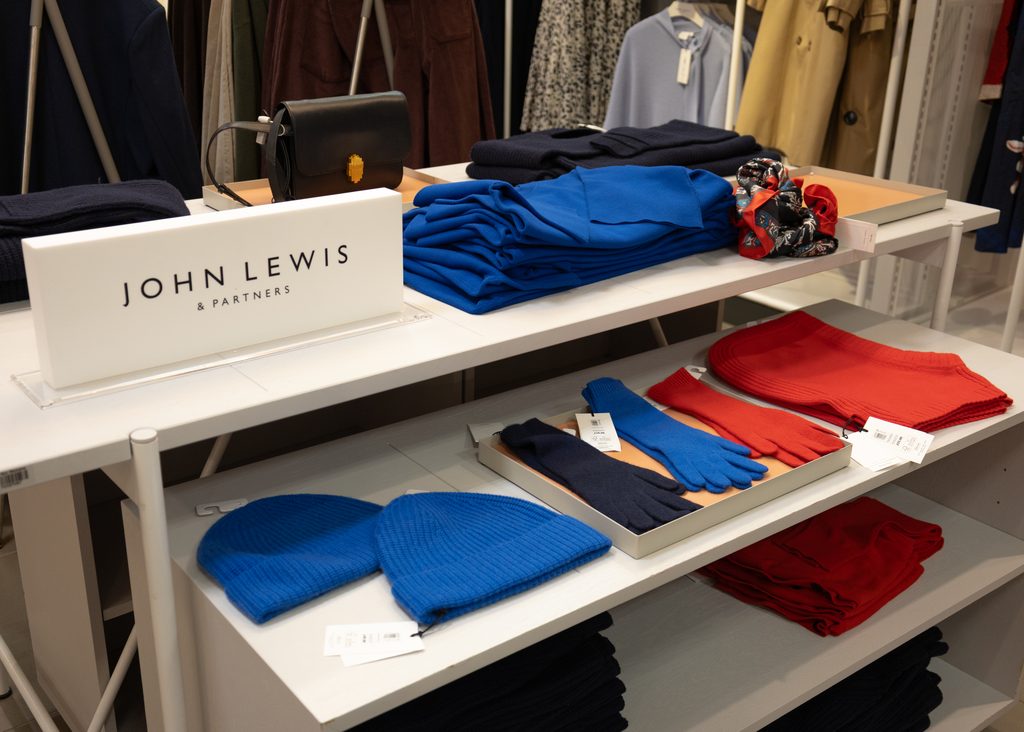 Colourful winter knitwear, scarves, gloves and beanies displayed at John Lewis & Partners in Eldon Square Newcastle.