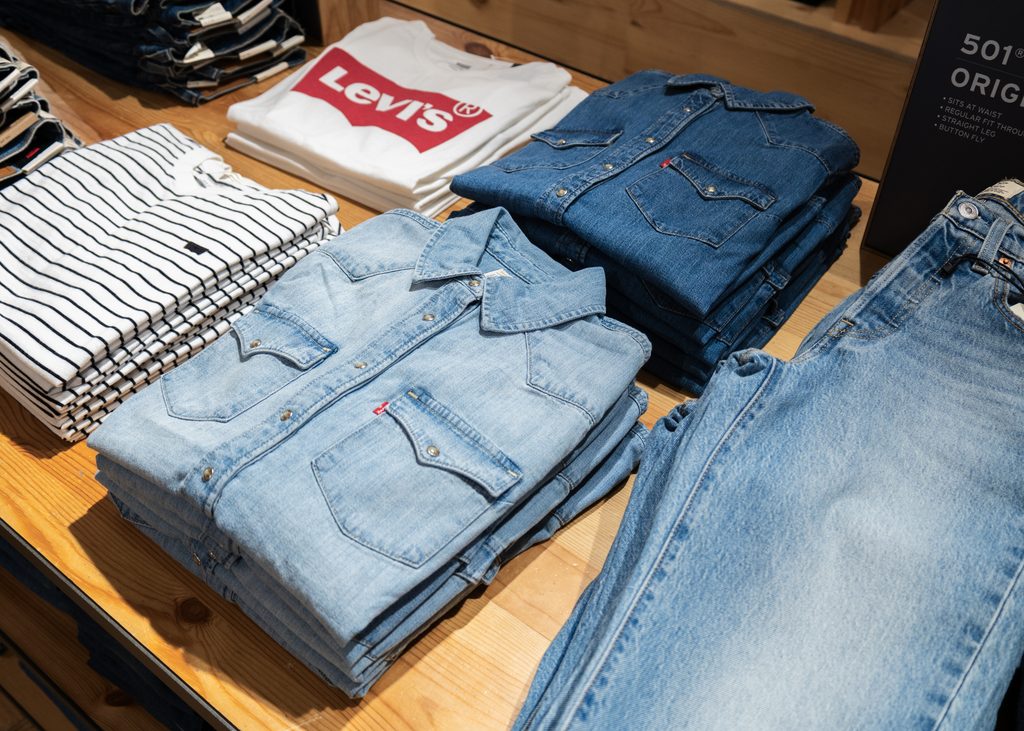 Levi’s denim jeans and Western shirts displayed in shades of blue alongside classic wardrobe staples at Eldon Square Newcastle.