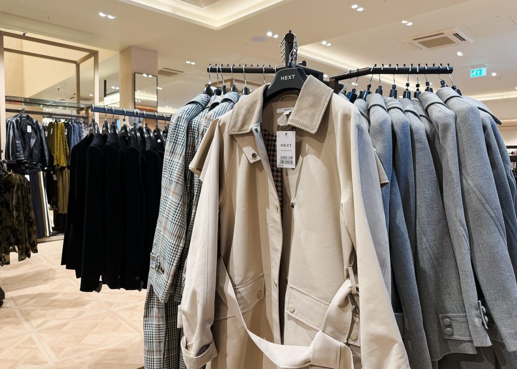 Stone-coloured jacket displayed alongside grey tailored winter coats and checked outerwear at Next, Eldon Square Newcastle.